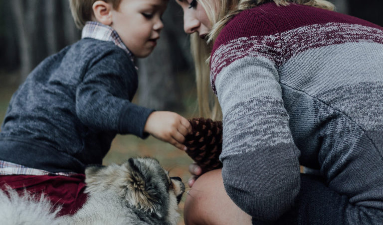 mother and child holding pinecone