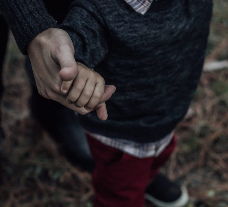 mother and child holding hands