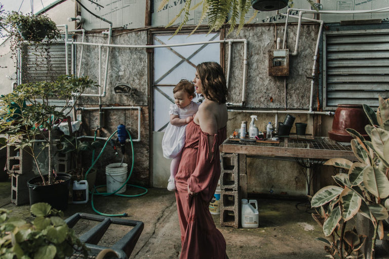 mother and daughter in a greenhouse